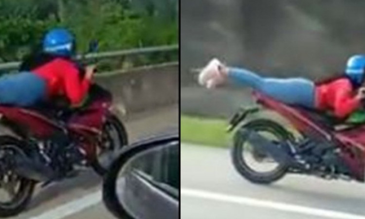 Naik Motor Ala Superman, Wanita Ini Bikin Heboh Warganet